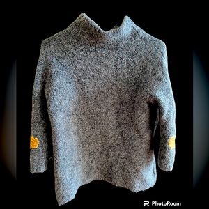 Anthropologie: gray sweater.